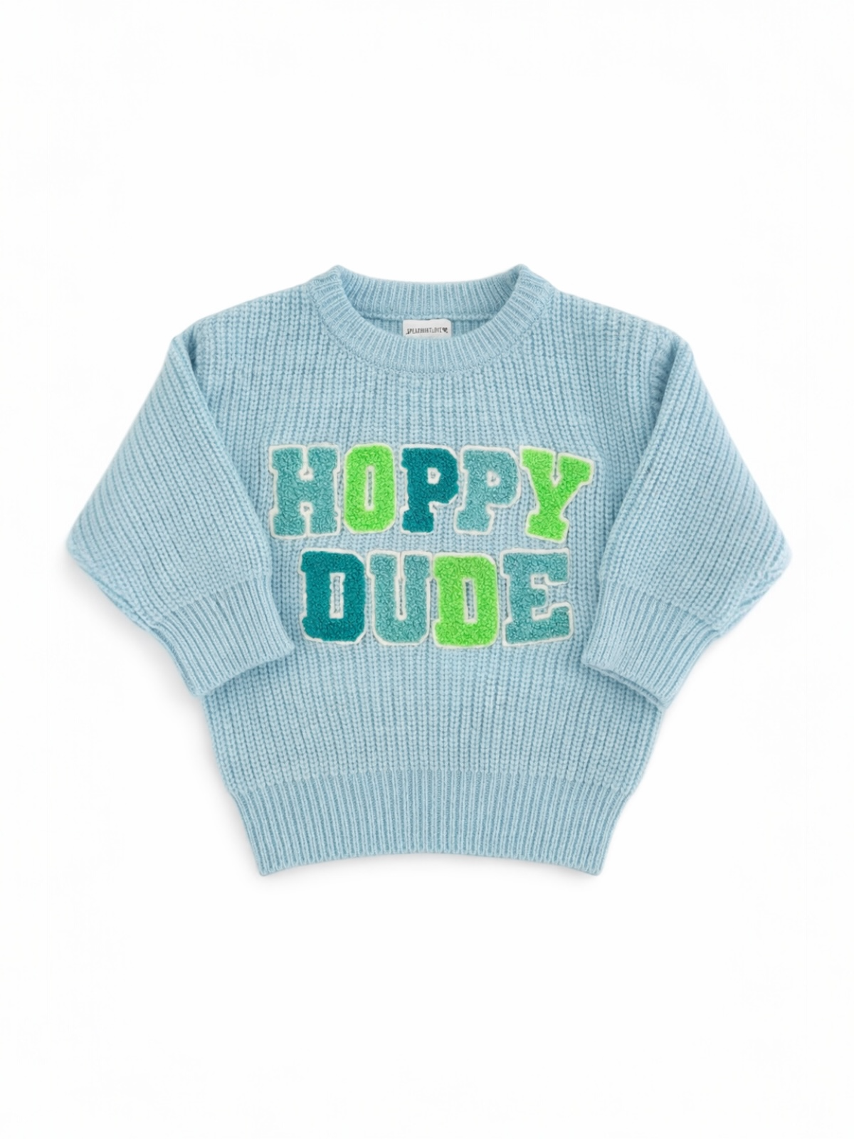 Light blue knitted sweater with "HOPPY DUDE" in colorful letters on the front. Ideal for casual wear.