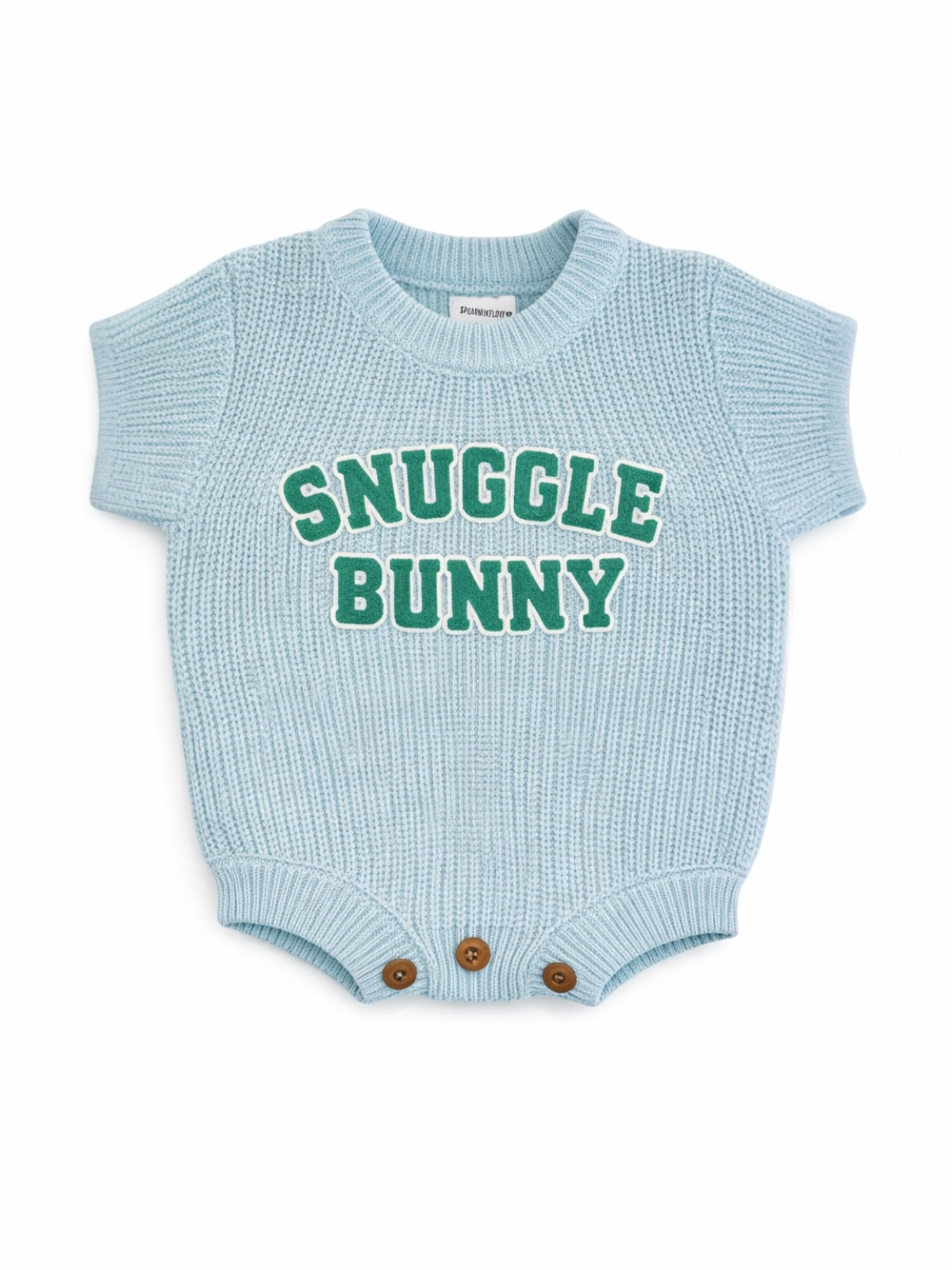 Light blue knitted baby onesie with "Snuggle Bunny" text and brown buttons at the bottom.