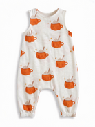 Toddler romper featuring a pattern of orange mugs with foam and stars on a light background.