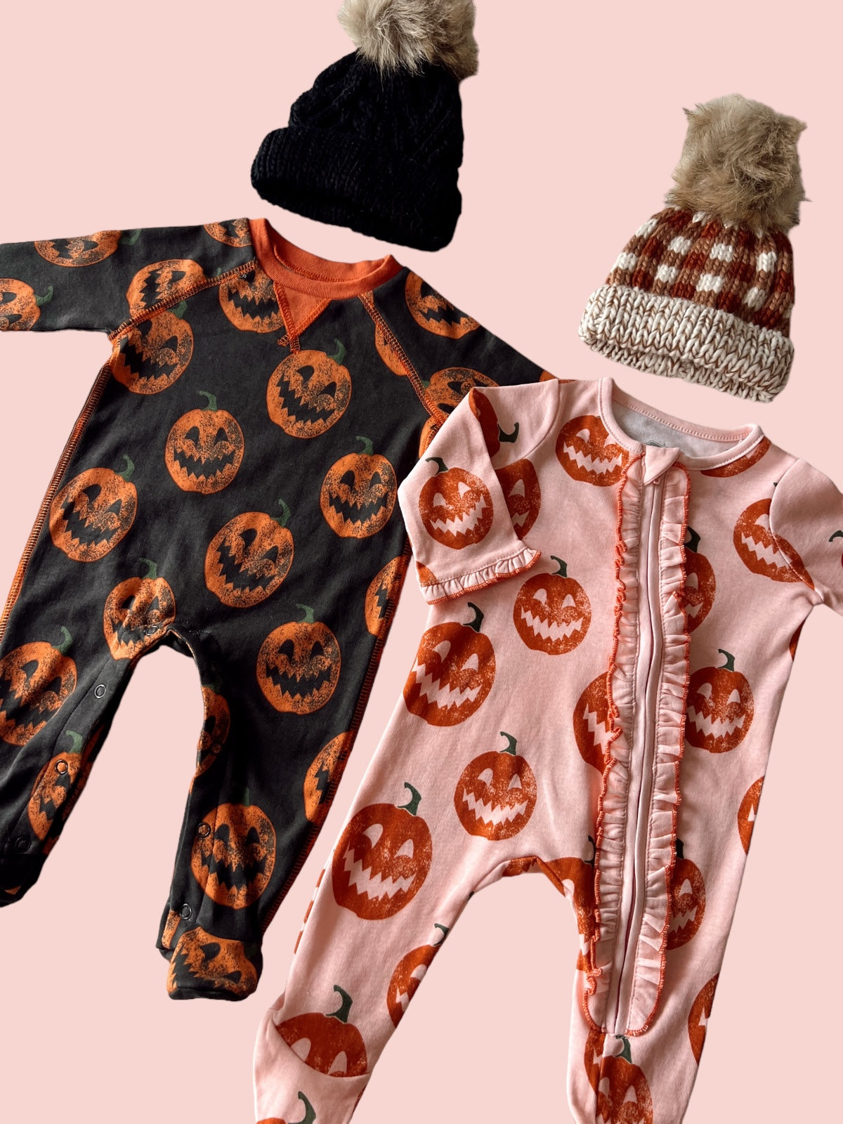 Two children's Halloween outfits featuring pumpkin designs and matching knit beanies on a pink background.