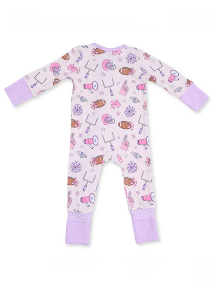 Back view of a pink pajama with sports-themed patterns and lavender cuffs, suitable for children.