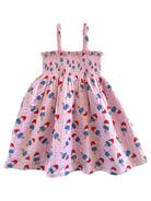 Pink dress with thin straps, featuring a pattern of colorful ice pop designs. Perfect for summer wear.