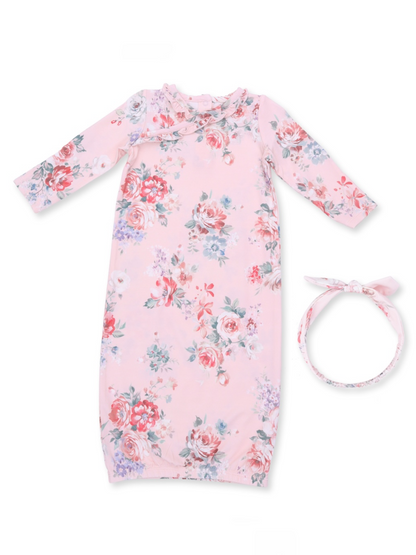 Pink floral baby gown with long sleeves and matching headband. Perfect for infants’ comfort and style.