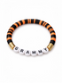 Colorful beaded bracelet featuring the word "GRAMMY" in white letters on a black and orange striped band.