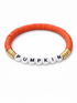 Orange beaded bracelet with white letter beads spelling "PUMPKIN" and gold accents.