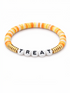 Colorful beaded bracelet with the word "TREAT" in white letters.