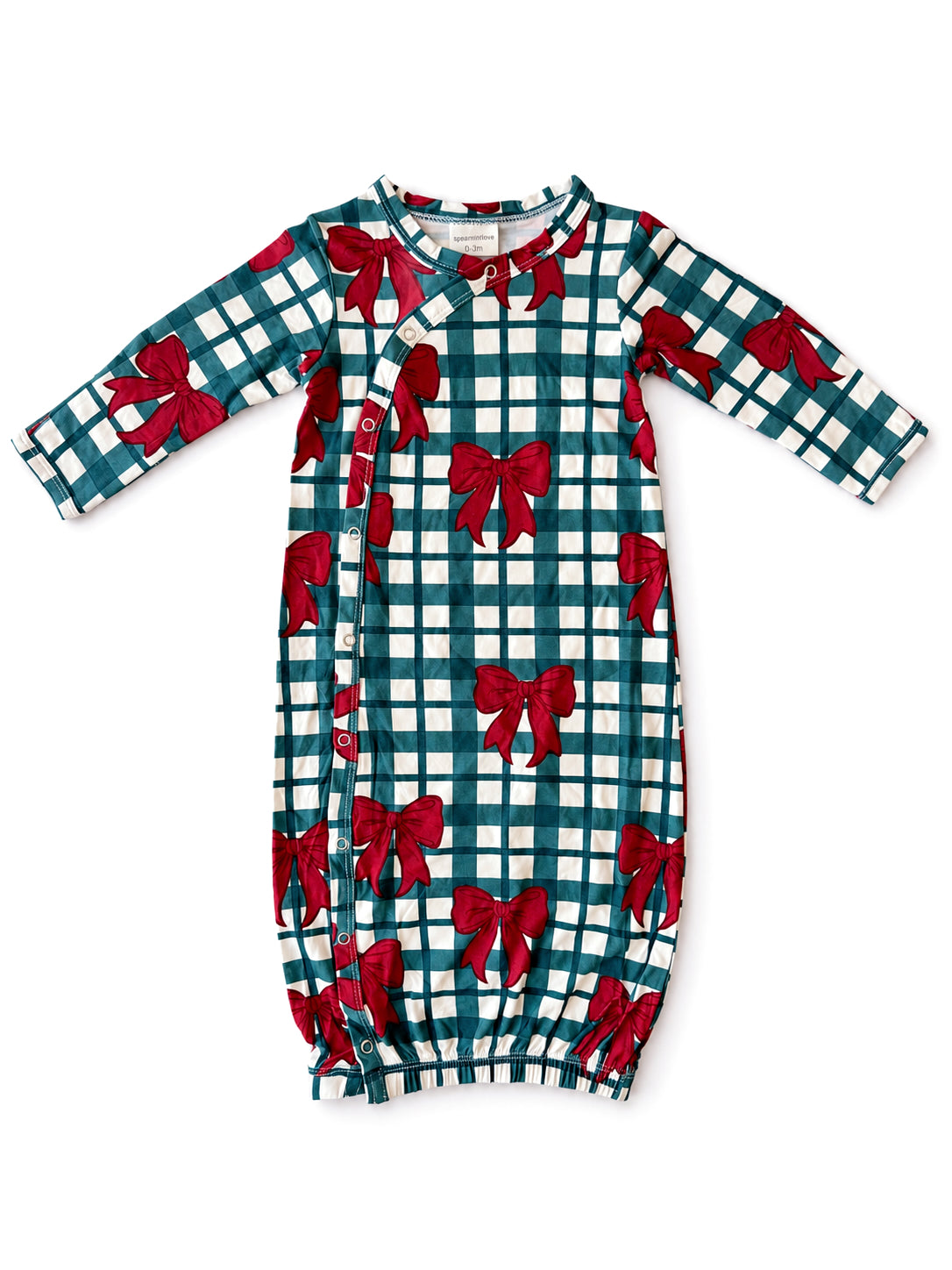 Green and white plaid infant gown with red bow print and side snap buttons. Ideal for cozy, festive wear.