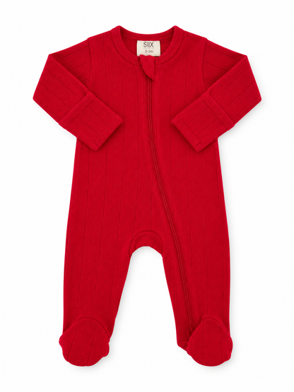 Red baby onesie with long sleeves and footed design, featuring a front zipper and ribbed texture. Size 0-3 months.