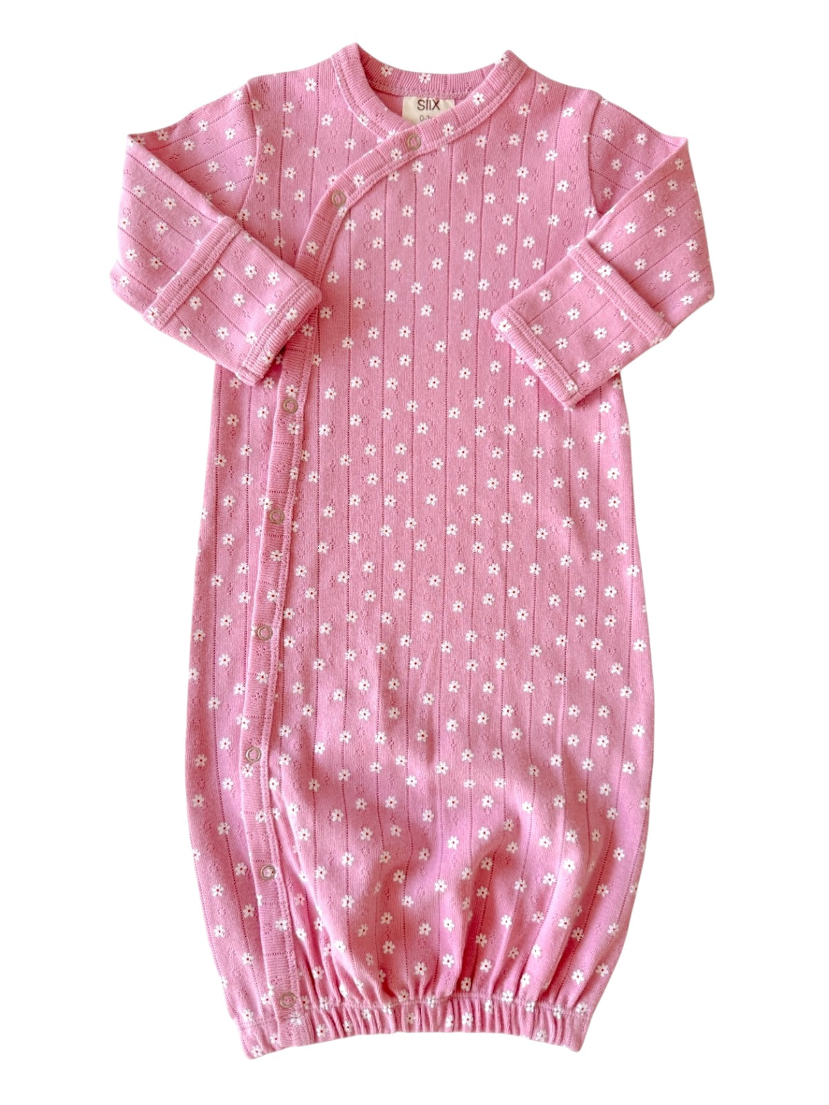 Pink baby gown with white floral pattern and snaps, featuring long sleeves and elasticized bottom.