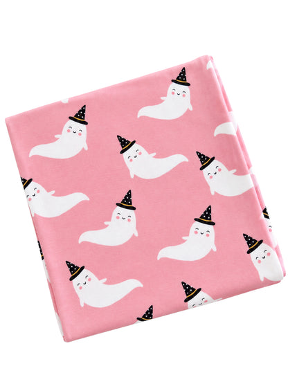 Pink fabric featuring cute, smiling ghosts wearing black witch hats. Perfect for Halloween-themed projects.