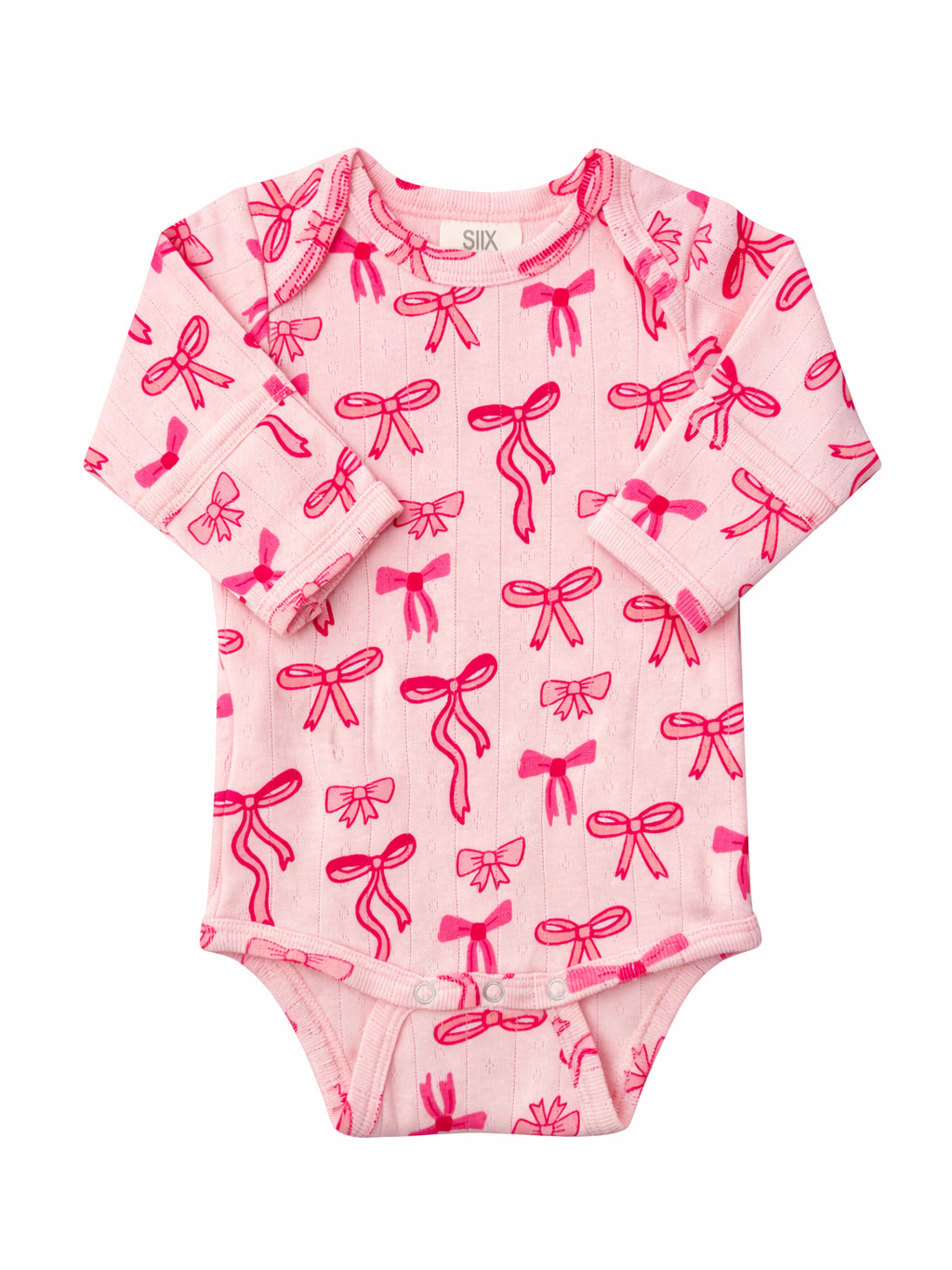 Pink baby onesie with a bright bow pattern, featuring long sleeves and snap closures at the bottom.