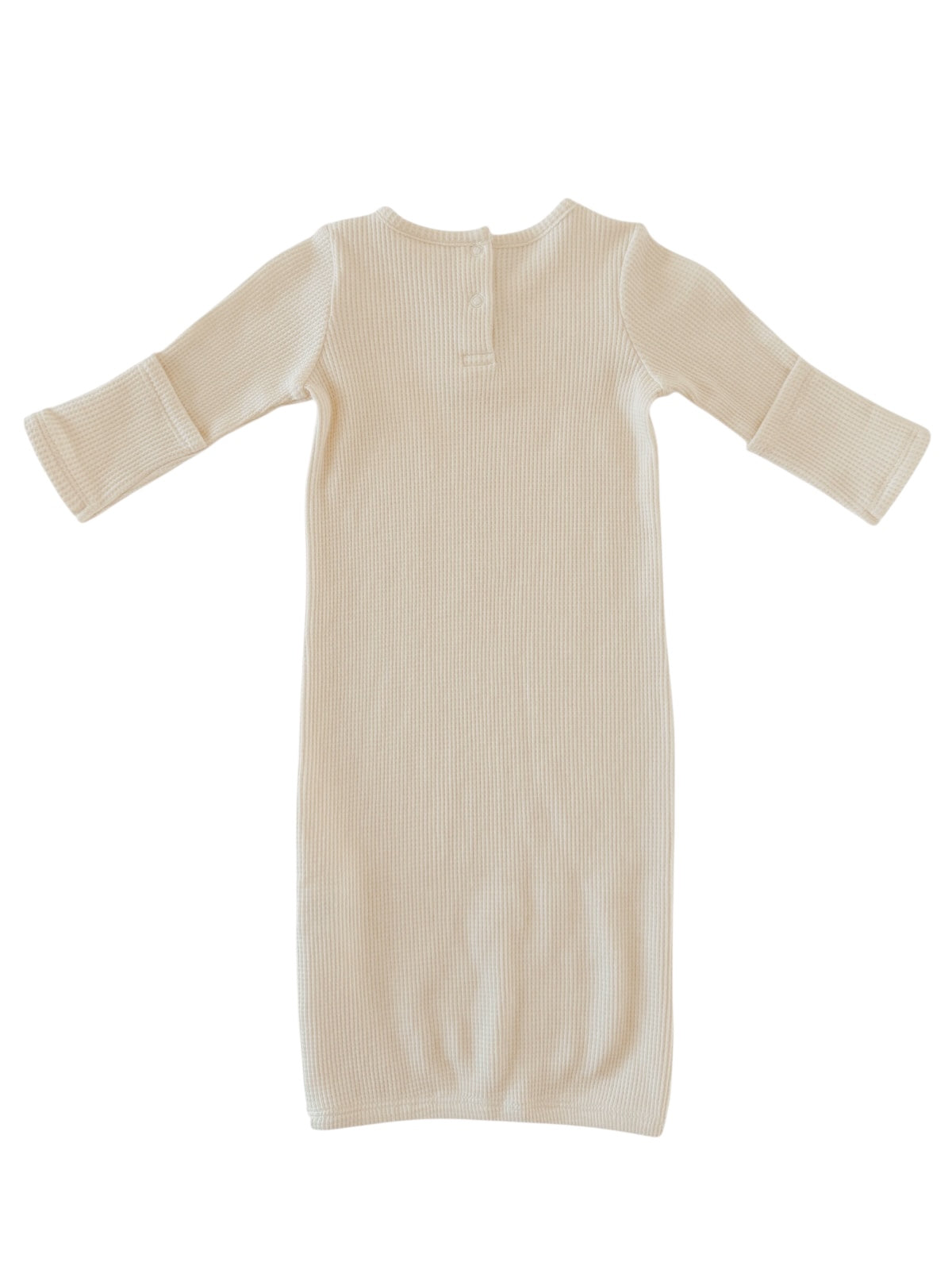 Beige ribbed long-sleeve dress with a back button detail, flat lay on a white background.