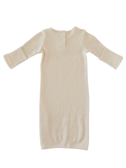 Beige ribbed long-sleeve dress with a back button detail, flat lay on a white background.