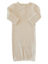 Cream-colored ribbed baby gown with long sleeves and a wrap design. Ideal for comfort and easy dressing.