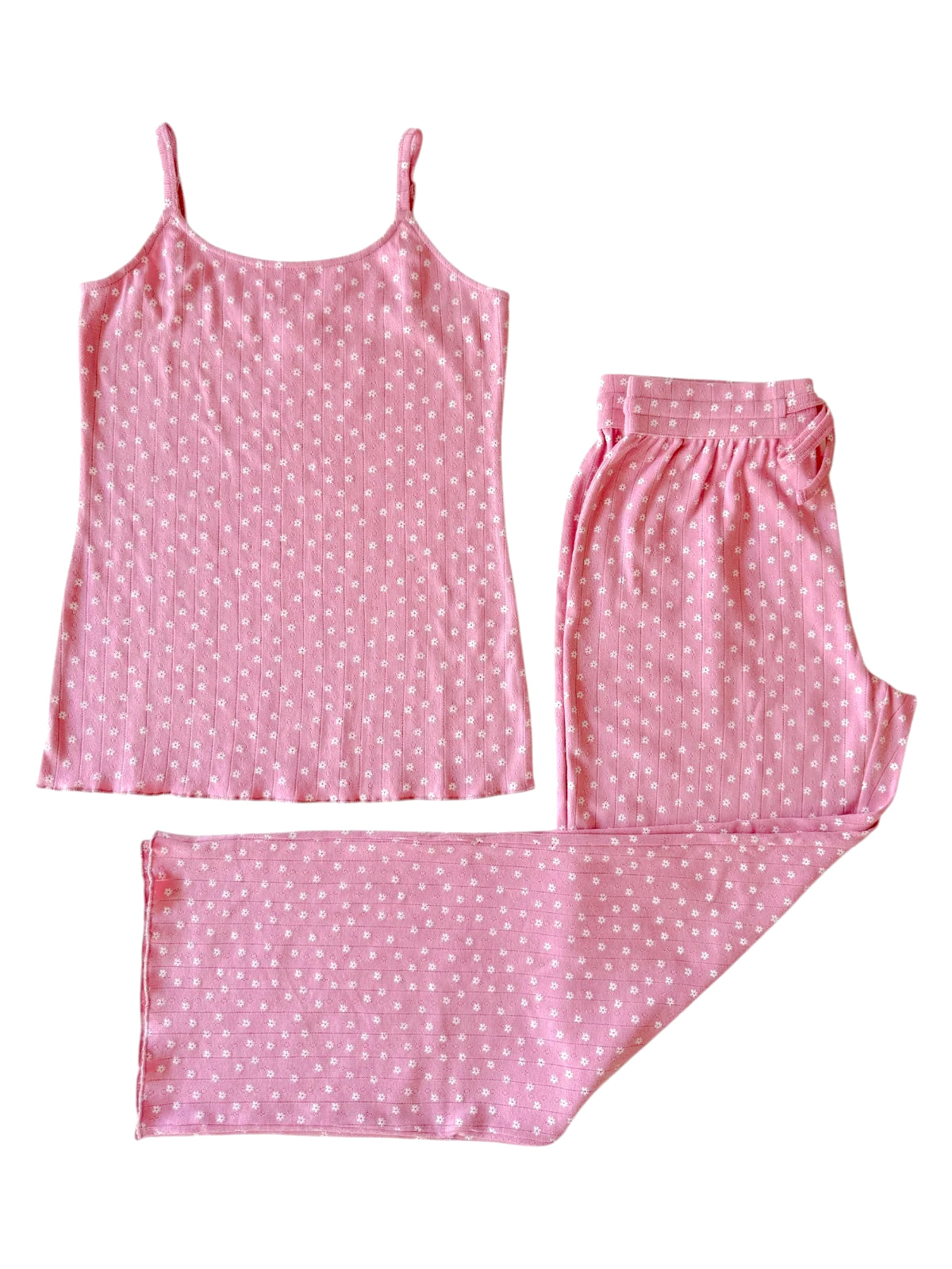 Pink pajama set featuring a spaghetti strap top and matching pants with a floral pattern.