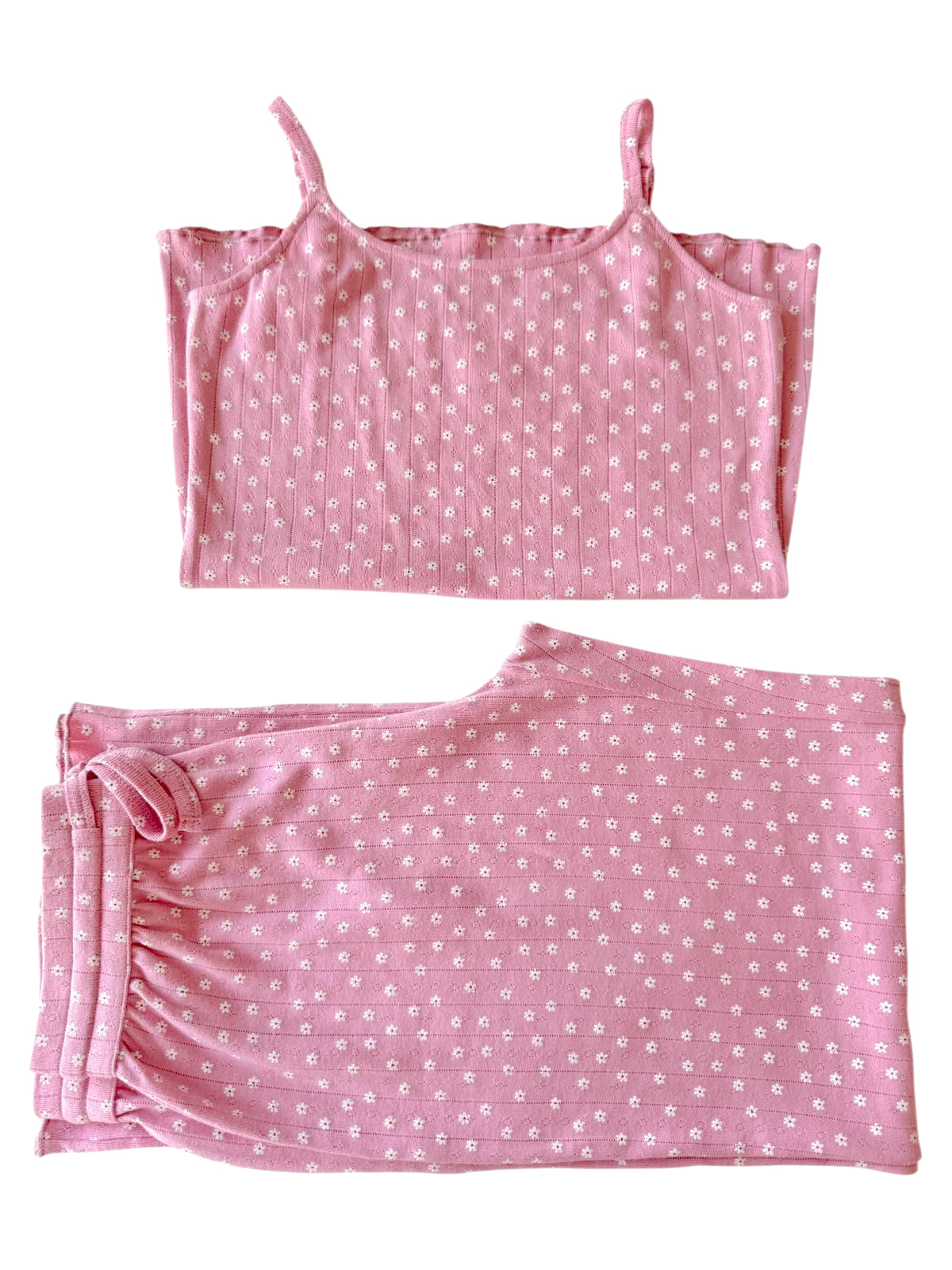 Pink floral-patterned camisole and pants set displayed on a white background.