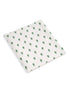 White fabric with a repeating cactus pattern in green.
