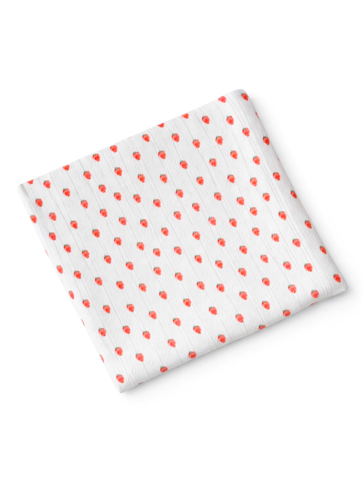 A folded fabric square with a white background and red strawberry pattern.