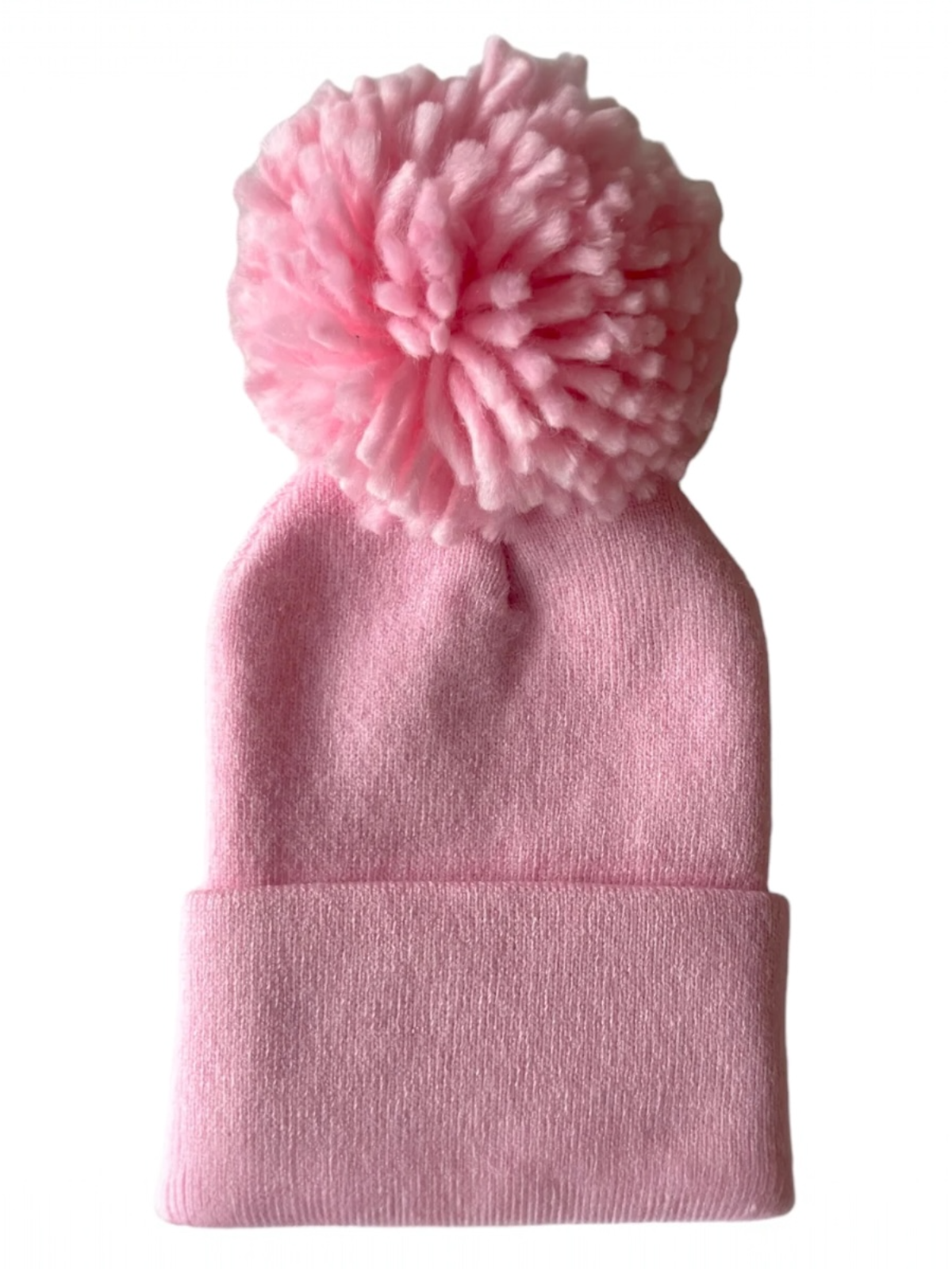 Pink knitted beanie with a large fluffy pom-pom on top.