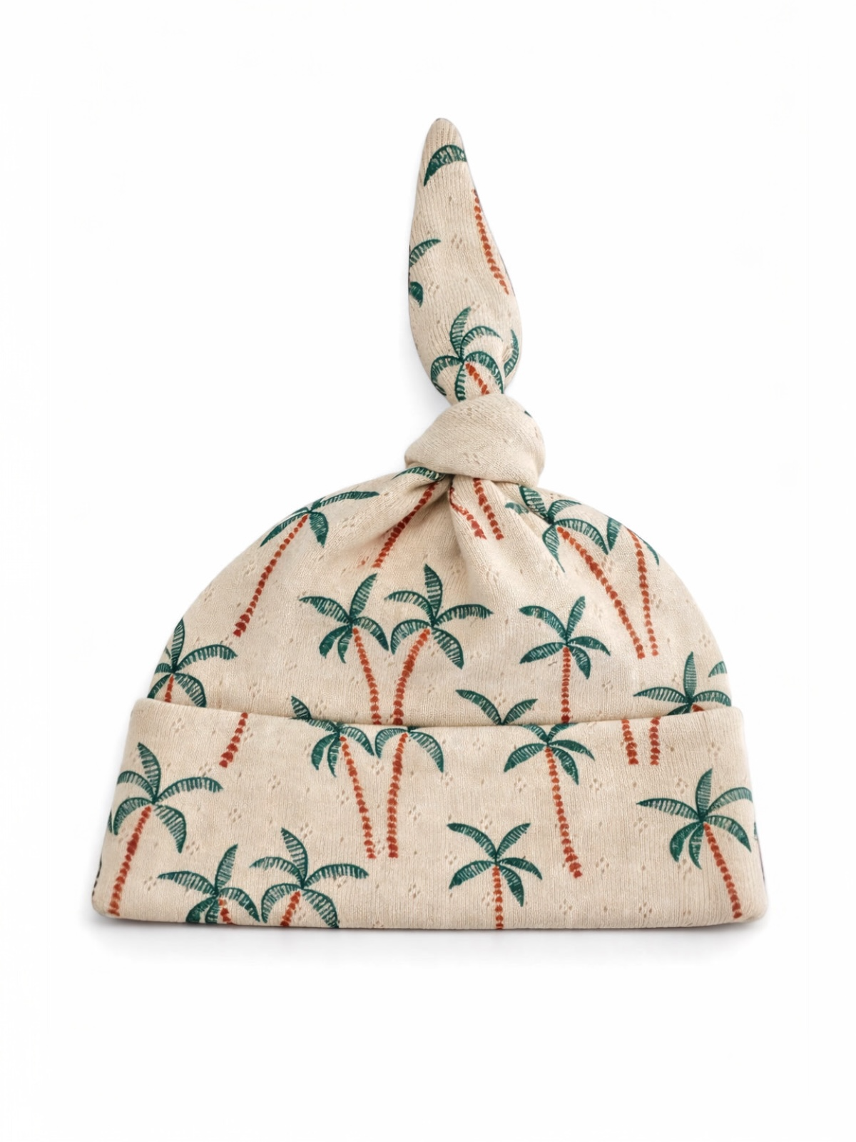 Palm-patterned beanie hat with a knotted top, designed for a casual, tropical style.