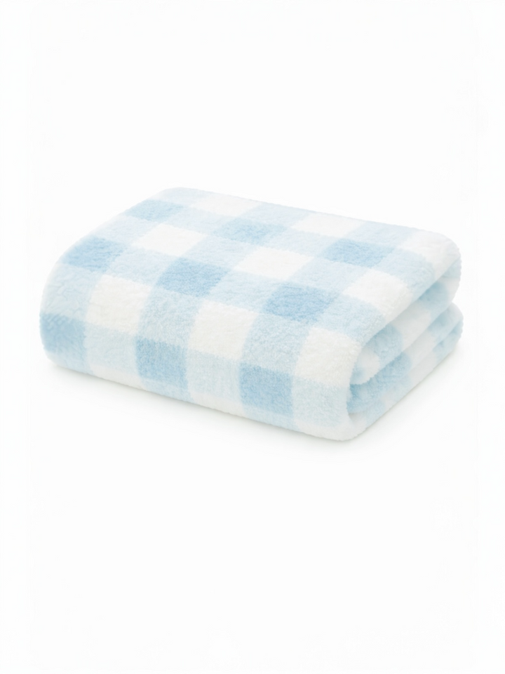 Folded soft blanket with a light blue and white checkered pattern on a white background.