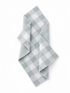 Gray and white checked dish towel folded on a white background. Ideal for kitchen use and decor.