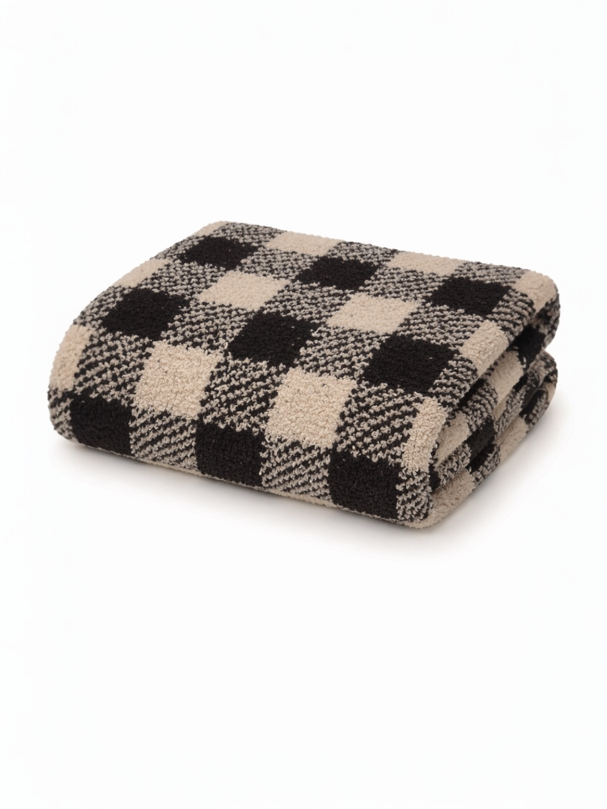 Folded beige and black checkered blanket on a white background. Soft texture, perfect for cozying up.