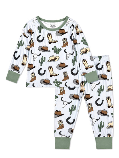 Cowboy-themed kids' pajamas with boots, hats, and cacti patterns on a light background.