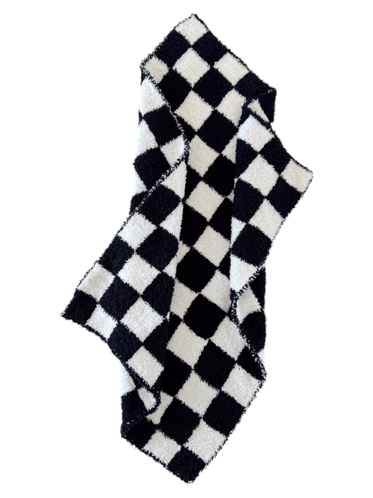 Black and white checkered blanket draped casually, showcasing a soft texture and bold pattern.