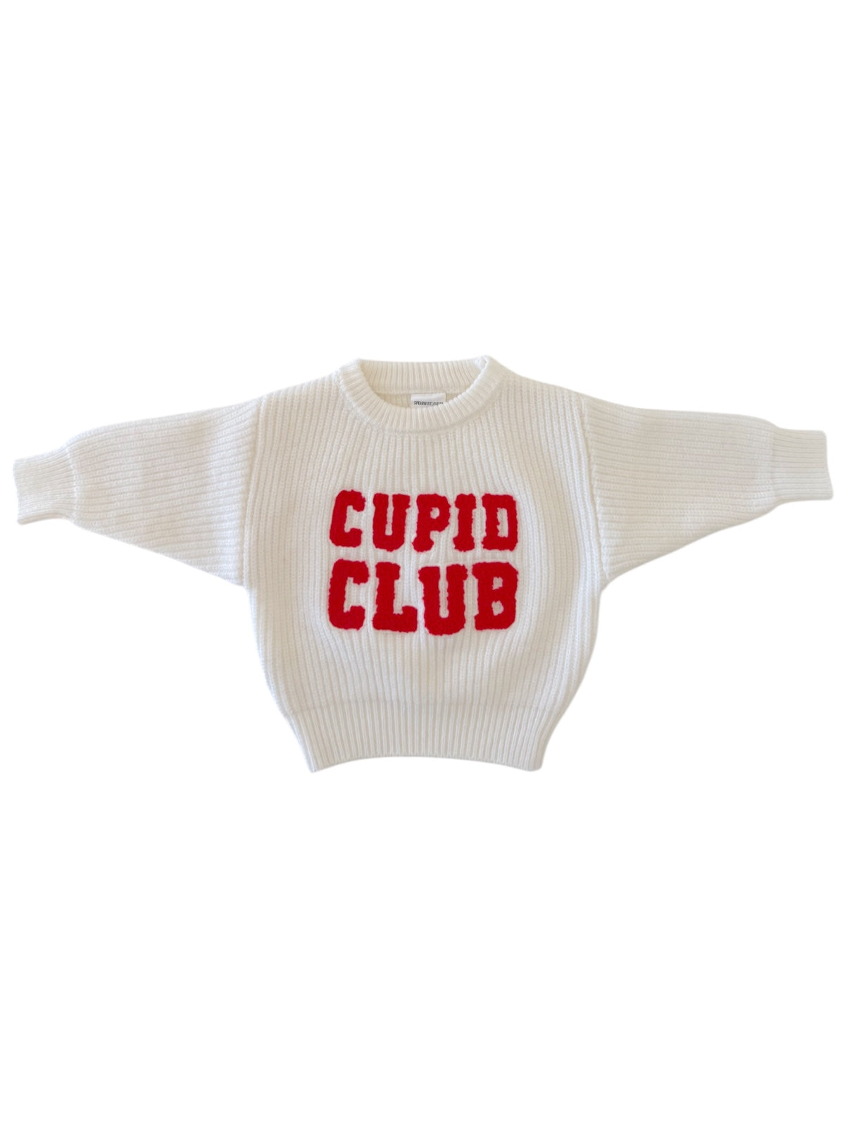 White sweater with red "Cupid Club" lettering on the front, featuring a cozy oversized design.