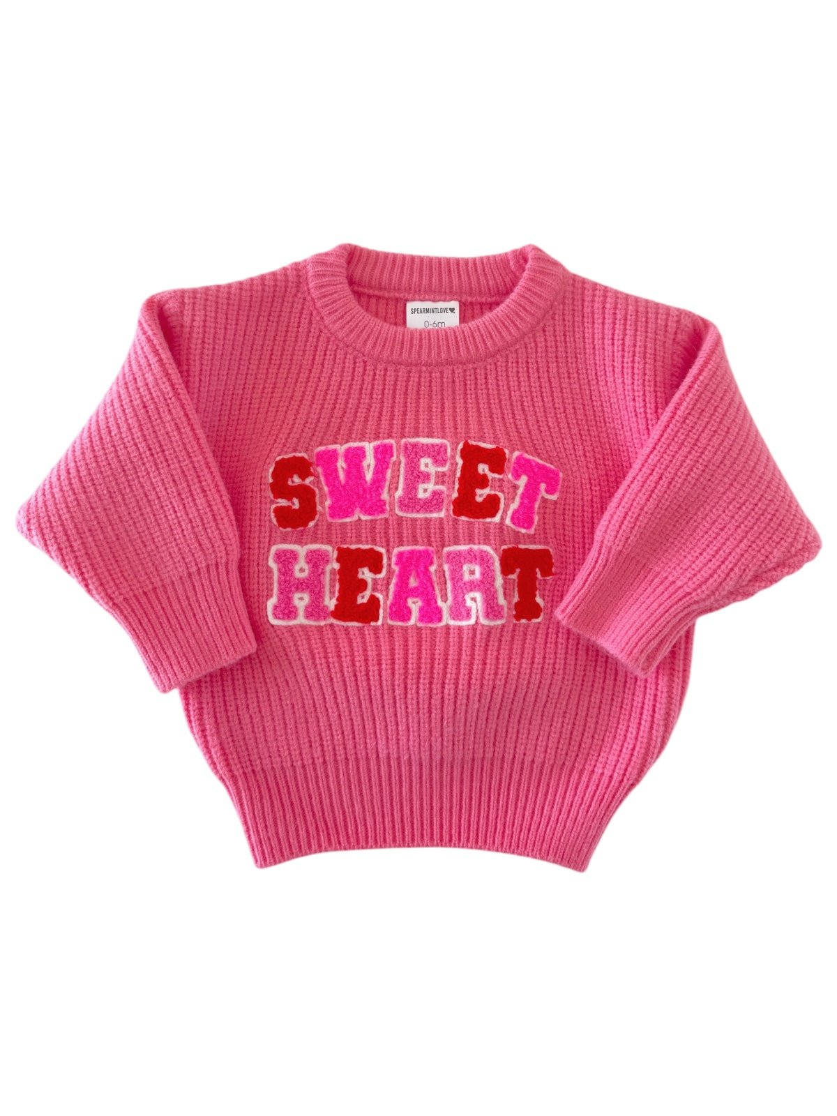 Pink sweater featuring "SWEET HEART" text in colorful letters on the front. Ideal for kids' fashion.
