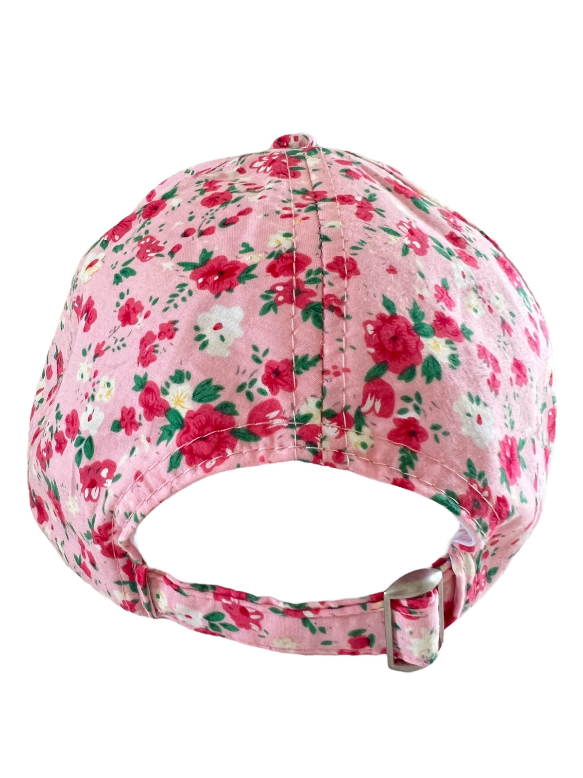 Back view of a pink floral baseball cap with green and red flowers, featuring an adjustable strap.