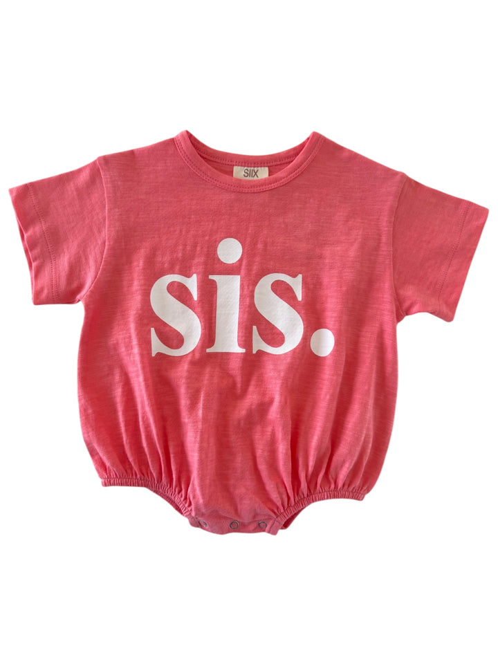 Pink baby onesie with white text that says "sis." on the front.