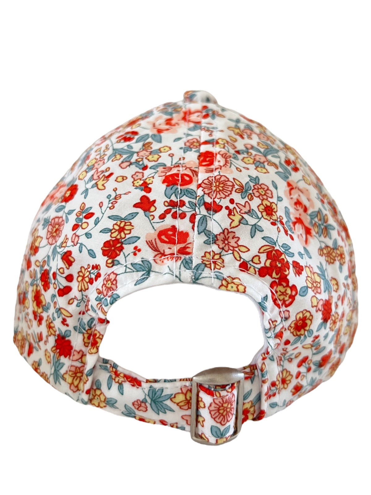 Back view of a floral baseball cap featuring red and blue flowers on a white background.