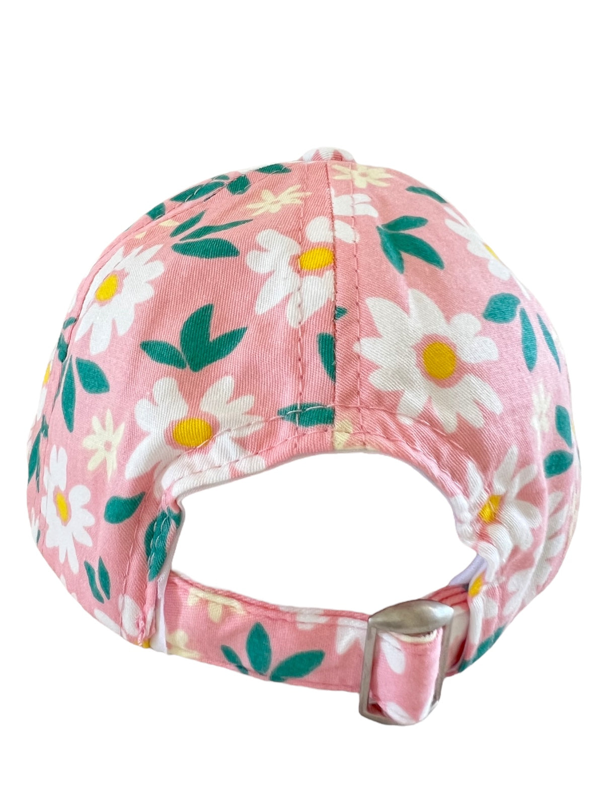 Pink cap with white daisies and green leaves, showing the back and adjustable strap.