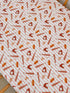 Patterned fabric featuring various baseball-related items like bats, balls, and hot dogs on a striped background.