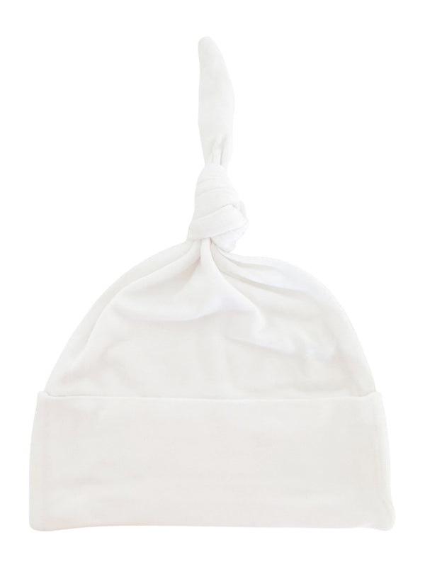 White baby hat with a knotted top and folded cuff, made of soft fabric.