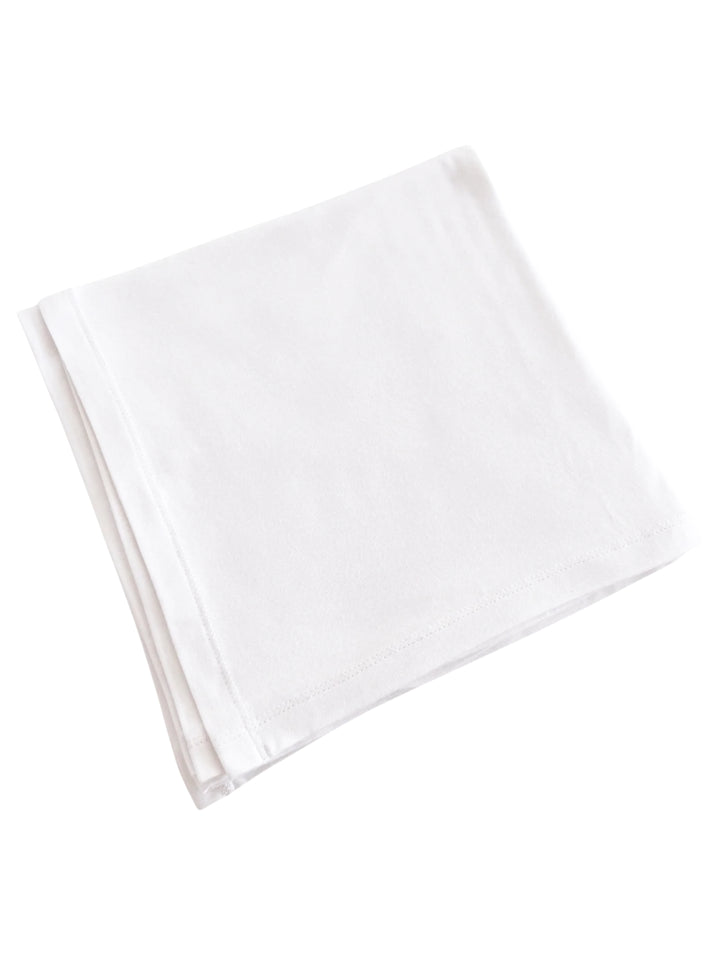 White cotton handkerchief folded neatly on a flat surface.