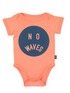 Coral baby onesie with circular design featuring the words "NO WAVES" in navy blue.