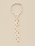 Beige tie with floral patterns on a light background, elegantly displayed for a stylish look.