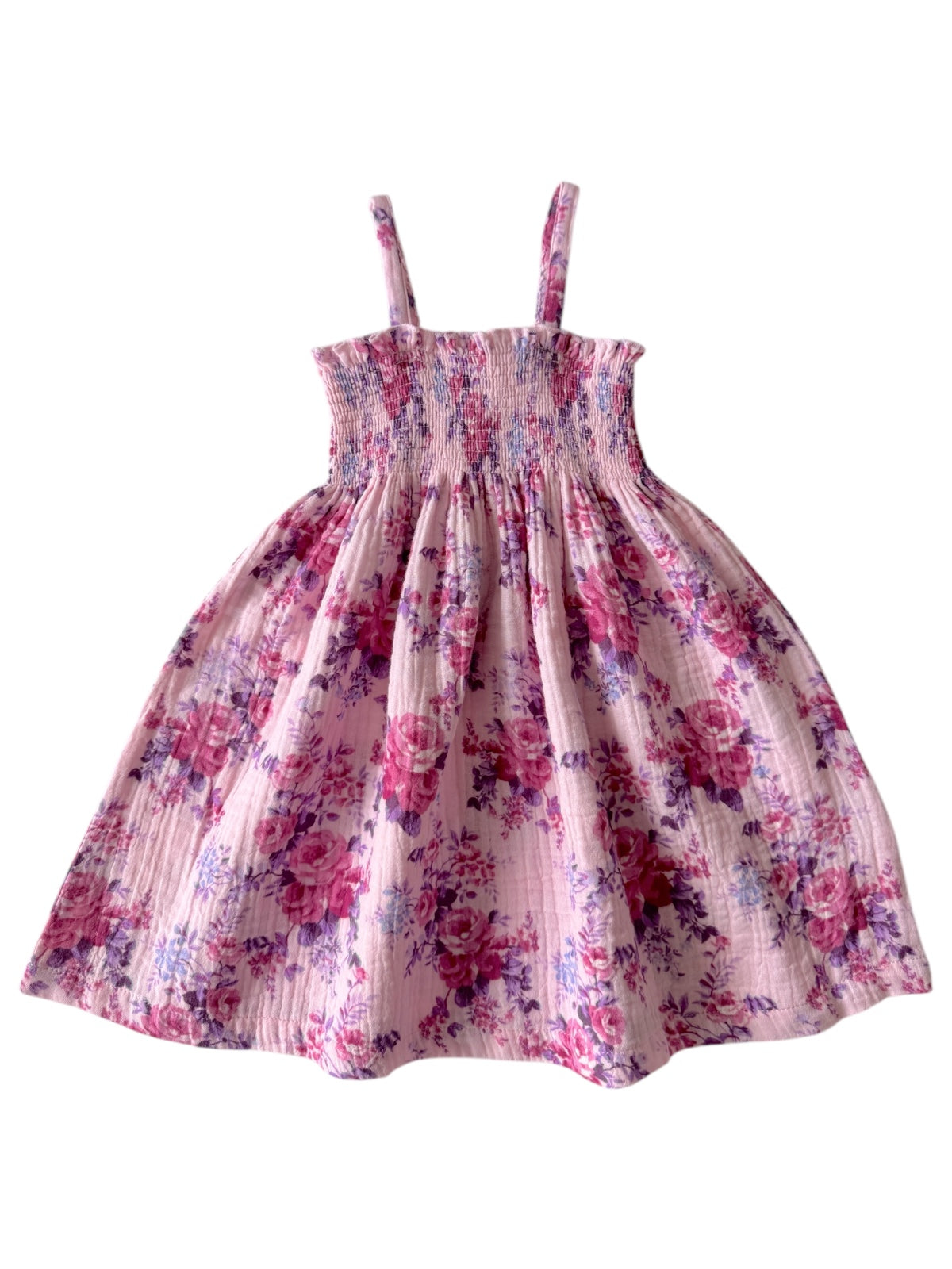 Floral pink dress with spaghetti straps and gathered bodice, featuring a flowing skirt.