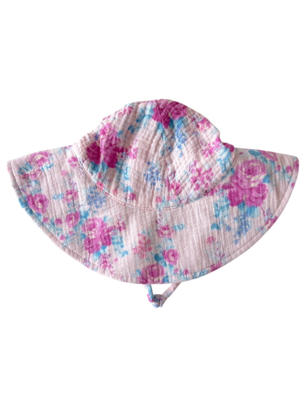 Light pink floral sun hat with a wide brim and a string for secure fit. Ideal for sunny outdoor activities.
