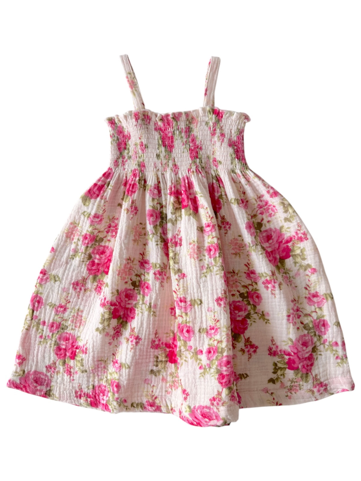 Floral children's dress with pink roses on a white background, featuring thin straps and a gathered skirt.
