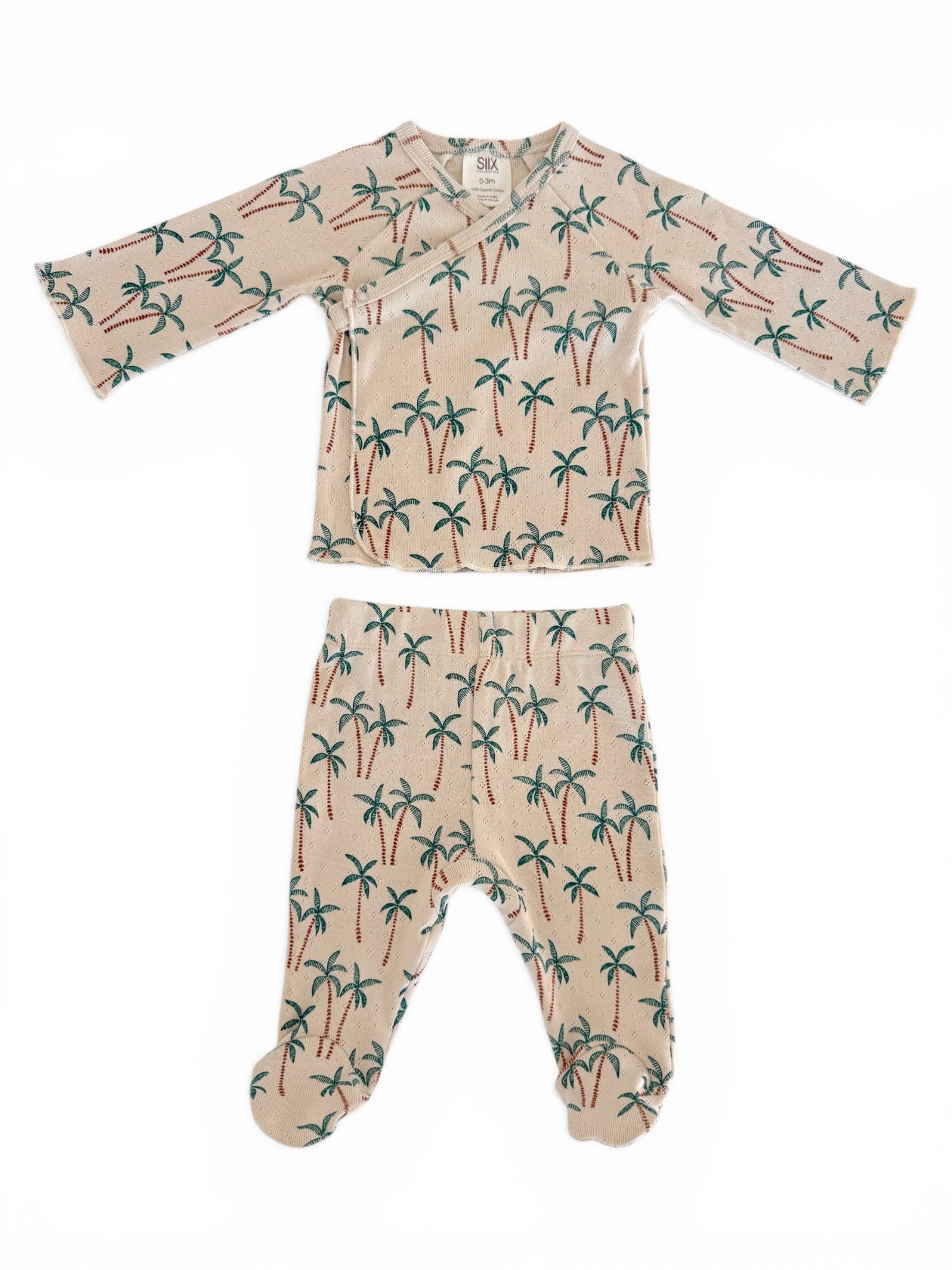 Beige baby outfit featuring palm tree print, including a long-sleeve top and footed pants.