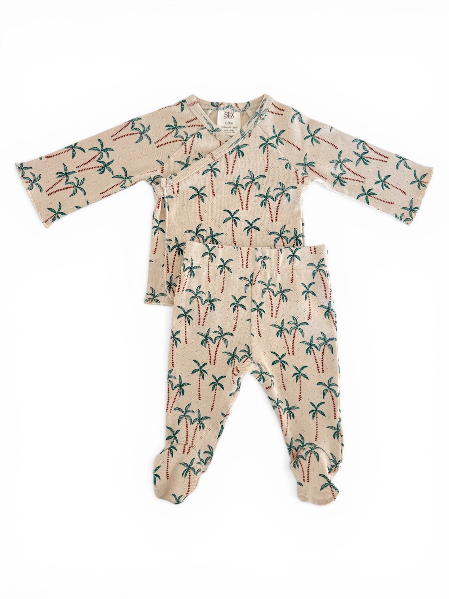 Beige infant outfit with palm tree prints, featuring a wrap top and matching pants.