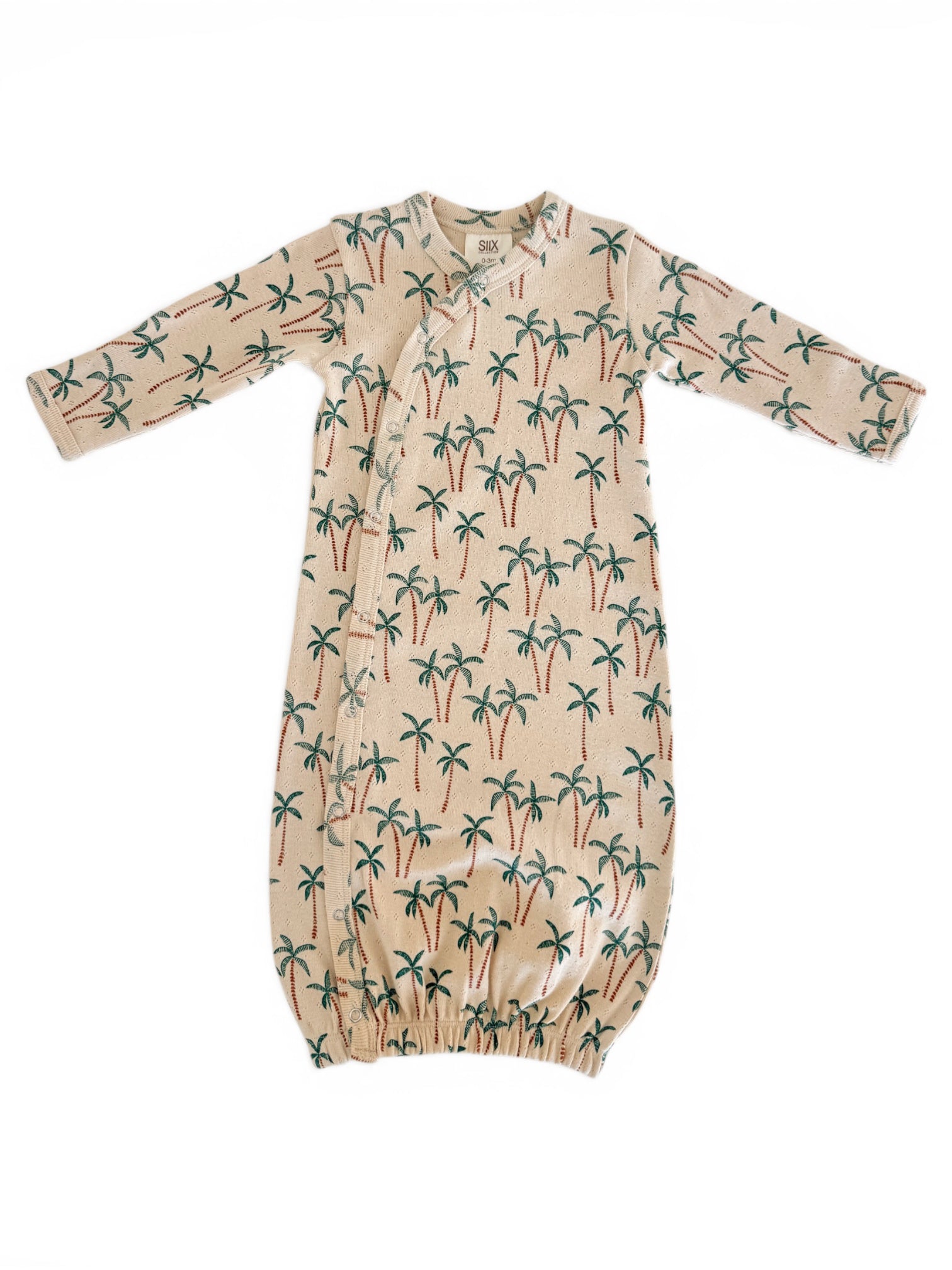 Lightweight baby gown with palm tree print, featuring long sleeves and a gathered bottom for comfort and style.