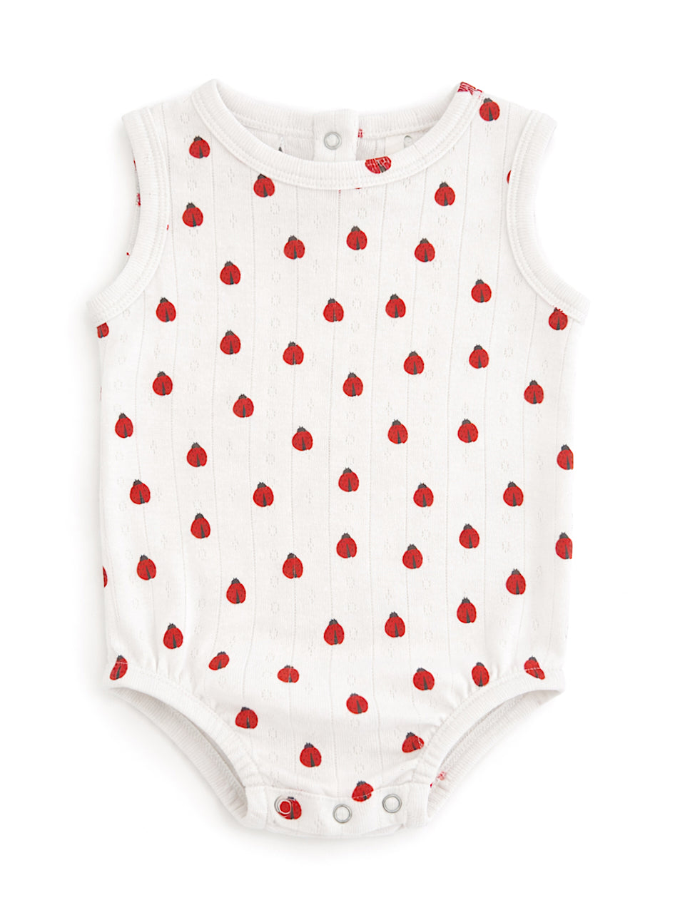 White baby onesie with red fruit print and snap closures at the bottom. Ideal for warm weather.