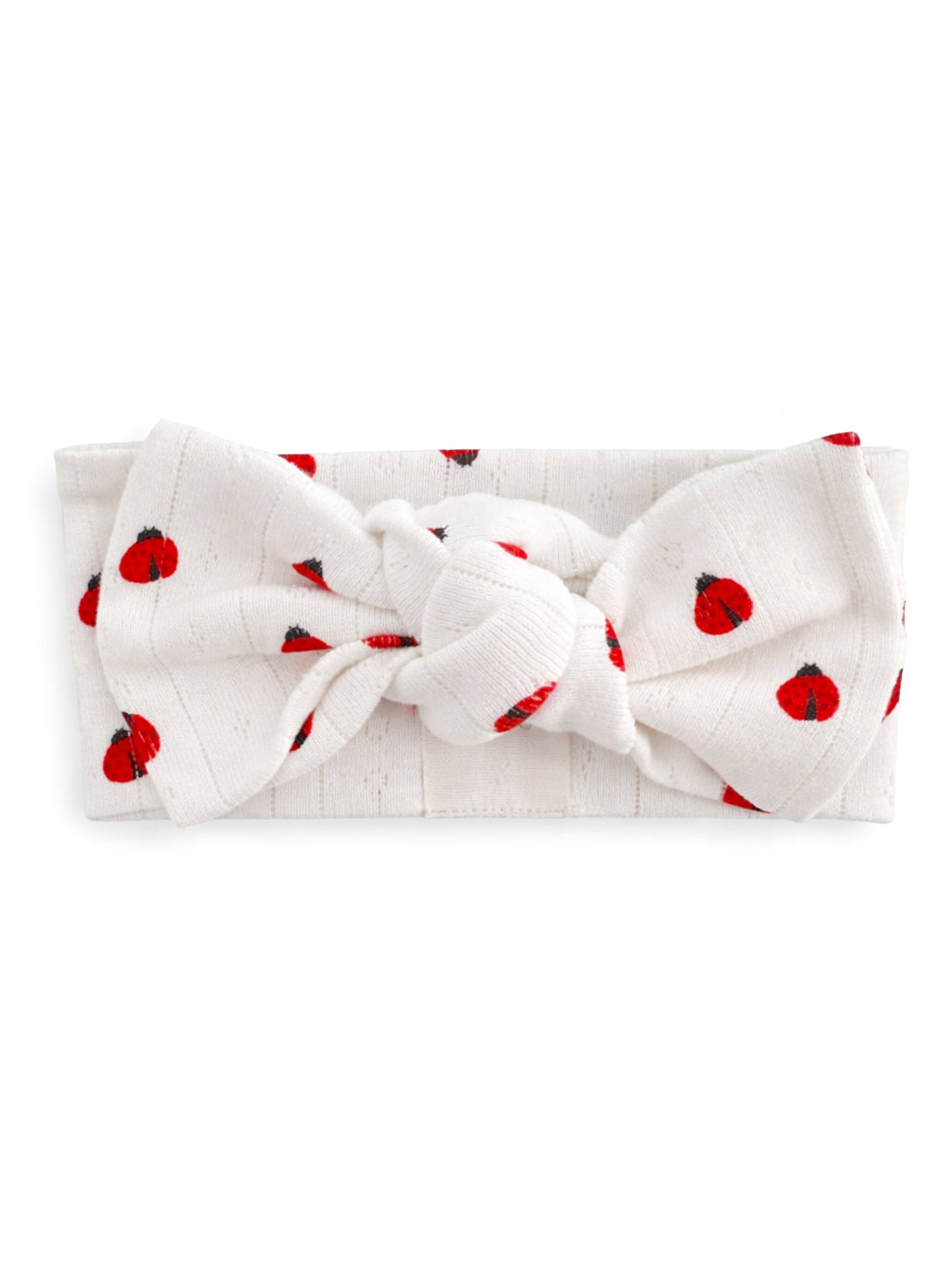 White headband with a large bow, featuring red ladybug prints throughout.