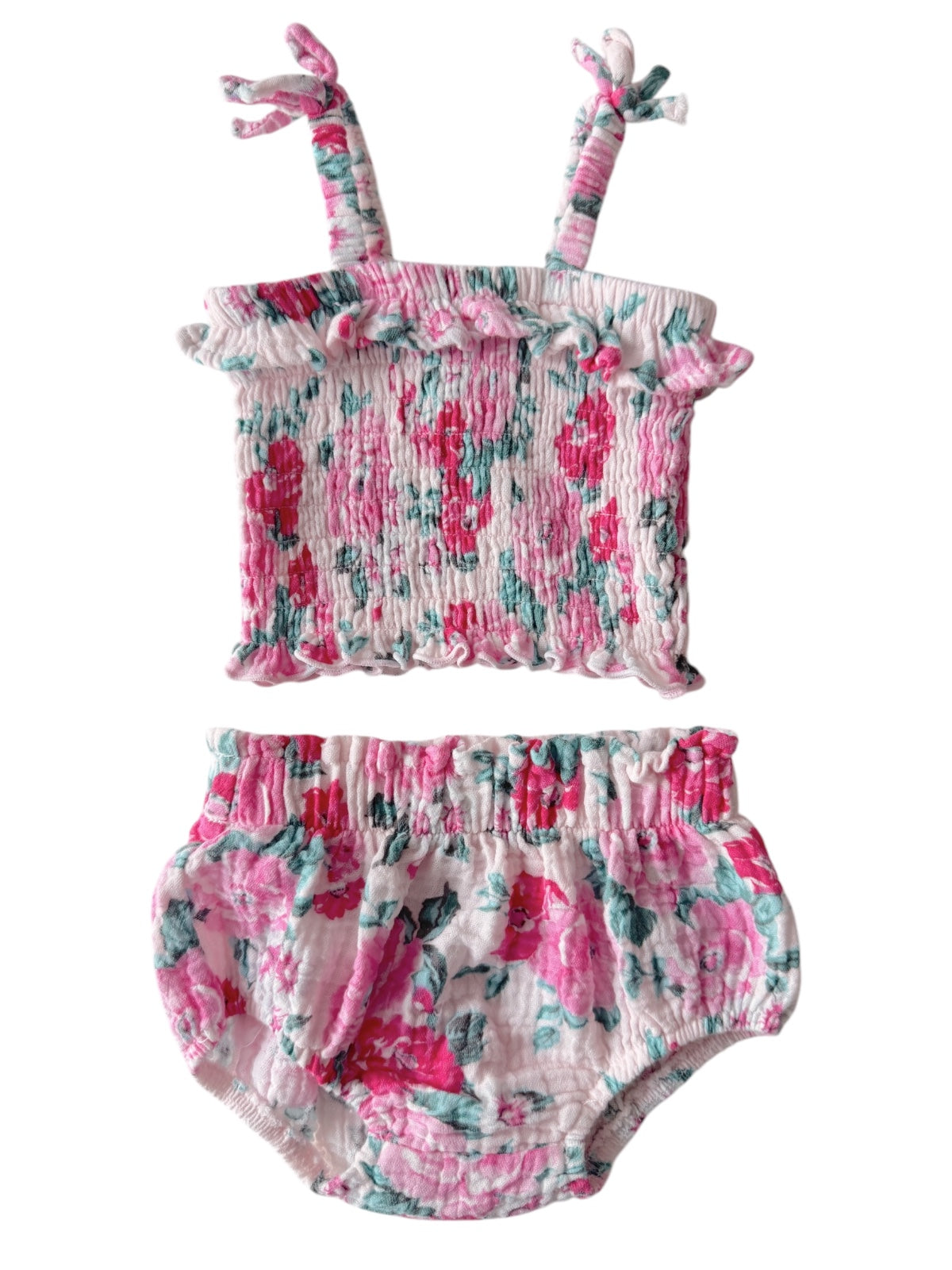 Floral baby two-piece set featuring a ruffled crop top and matching bloomers in pink and teal colors.