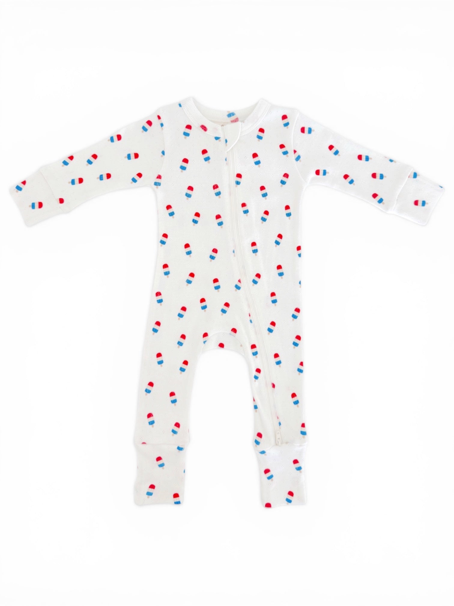 Light-colored baby onesie with red, blue, and white popsicle prints, featuring long sleeves and a front zipper.